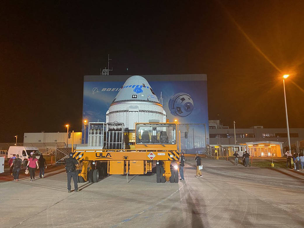 Boeing’s CST-100 Starliner spacecraft rolls out from the company’s Commercial Crew and Cargo Processing Facility at NASA’s Kennedy Space Center in Florida on July 17, 2021.