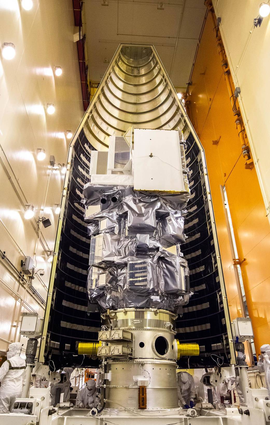 Inside the Integrated Processing Facility at Vandenberg Space Force Base in California, the Landsat 9 spacecraft is moved into position for encapsulation on Aug. 16, 2021. 