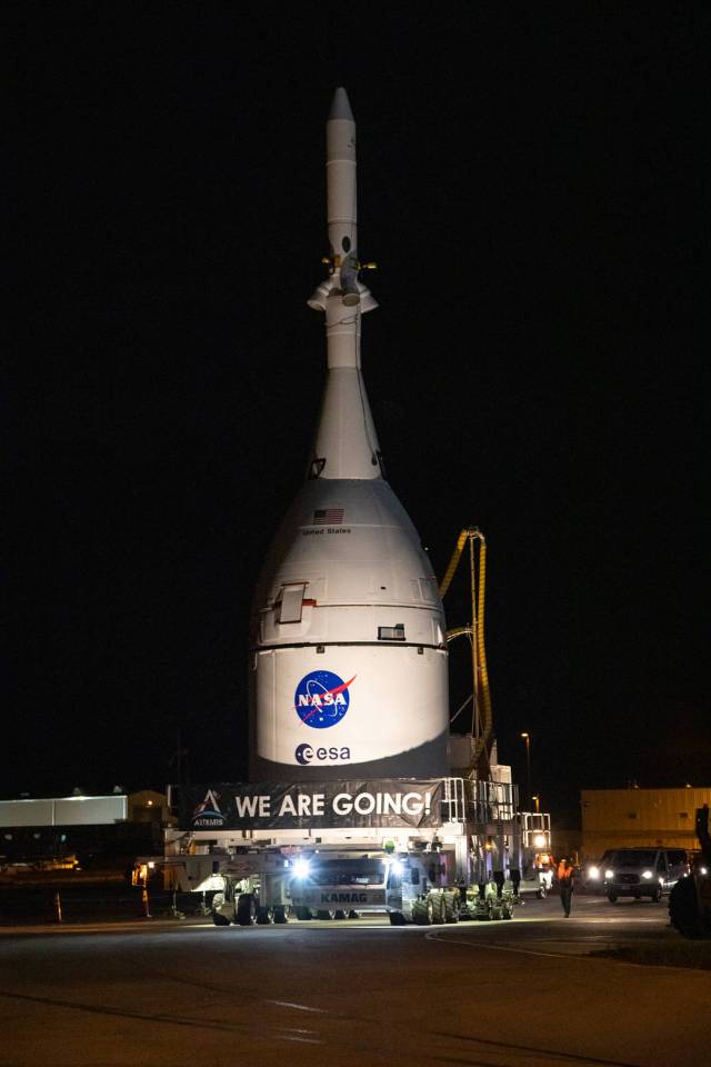 The Orion spacecraft for NASA’s Artemis I mission, fully assembled with its launch abort system, moves out of the Launch Abort System Facility at Kennedy Space Center in Florida on Oct. 19, 2021. 