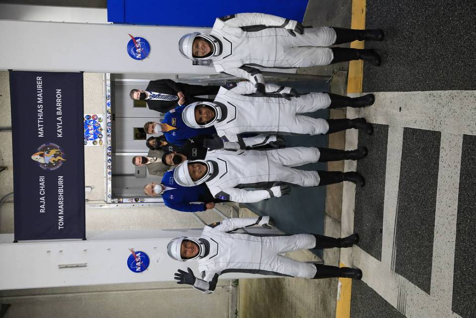 SpaceX Crew-3 astronauts wave to family and friends after walking out through the double doors below the Neil A. Armstrong Building’s Astronaut Crew Quarters at Kennedy Space Center on launch day, Nov. 10, 2021. 