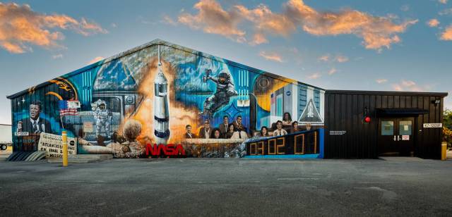 A mural painted by Florida artist Christopher Maslow adorns the northwest exterior wall of the Press Site News Facility at NASA’s Kennedy Space Center in Florida.