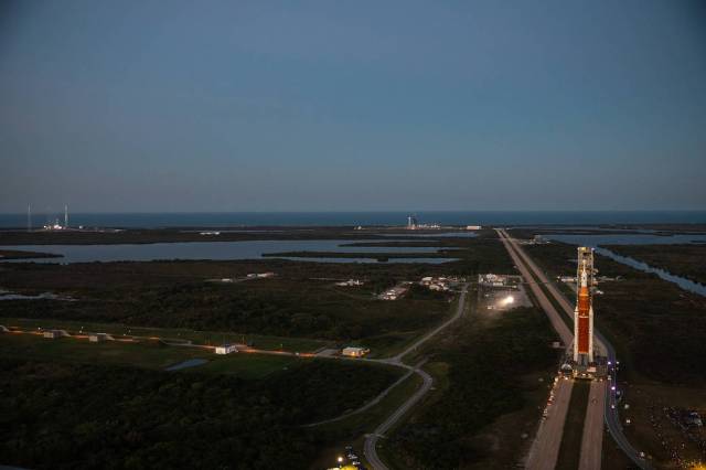 NASA’s Space Launch System (SLS) rocket, with the Orion capsule atop, slowly makes its way down the crawlerway at the agency’s Kennedy Space Center in Florida on March 17, 2022. 