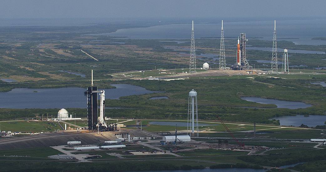 SpaceX’s Axiom-1 is in the foreground on Launch Pad 39A with NASA’s Artemis I in the background on Launch Pad 39B on April 6, 2022.