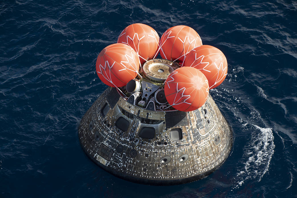 NASA's Orion spacecraft bobs in the water of the Pacific Ocean, after splashdown at 12:40 p.m. EST, Dec. 11, 2022, after a 25.5-day mission to the Moon.