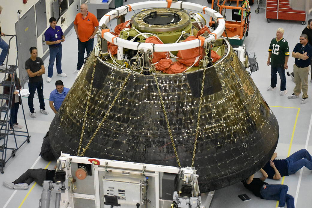 Inside the Multi Payload Processing Facility at NASA’s Kennedy Space Center in Florida, engineers and technicians conduct inspections of the heat shield on the Orion spacecraft for the Artemis I mission.