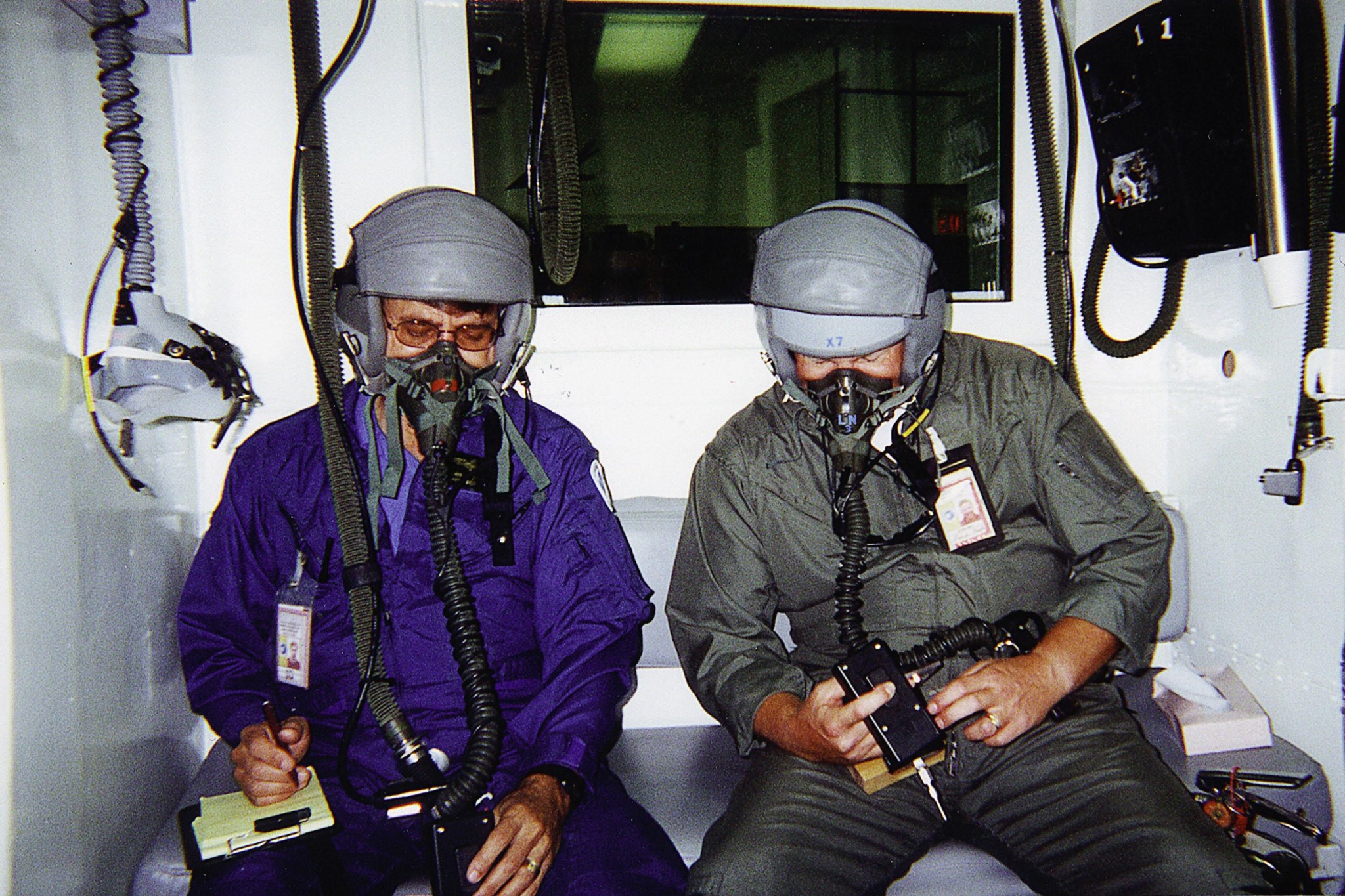 astronauts test a Personal Cabin Pressure Altitude Monitor