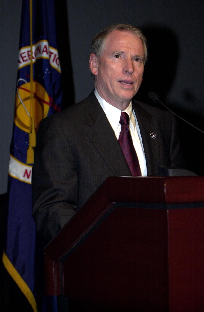 Dr. Daniel R. Mulville speaks at a meeting