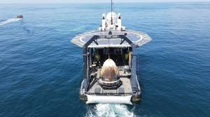 The SpaceX Crew Dragon spacecraft, with NASA astronauts Robert Behnken and Douglas Hurley inside, is seen aboard SpaceX’s GO Navigator recovery ship shortly after splashing down in the Gulf of Mexico.