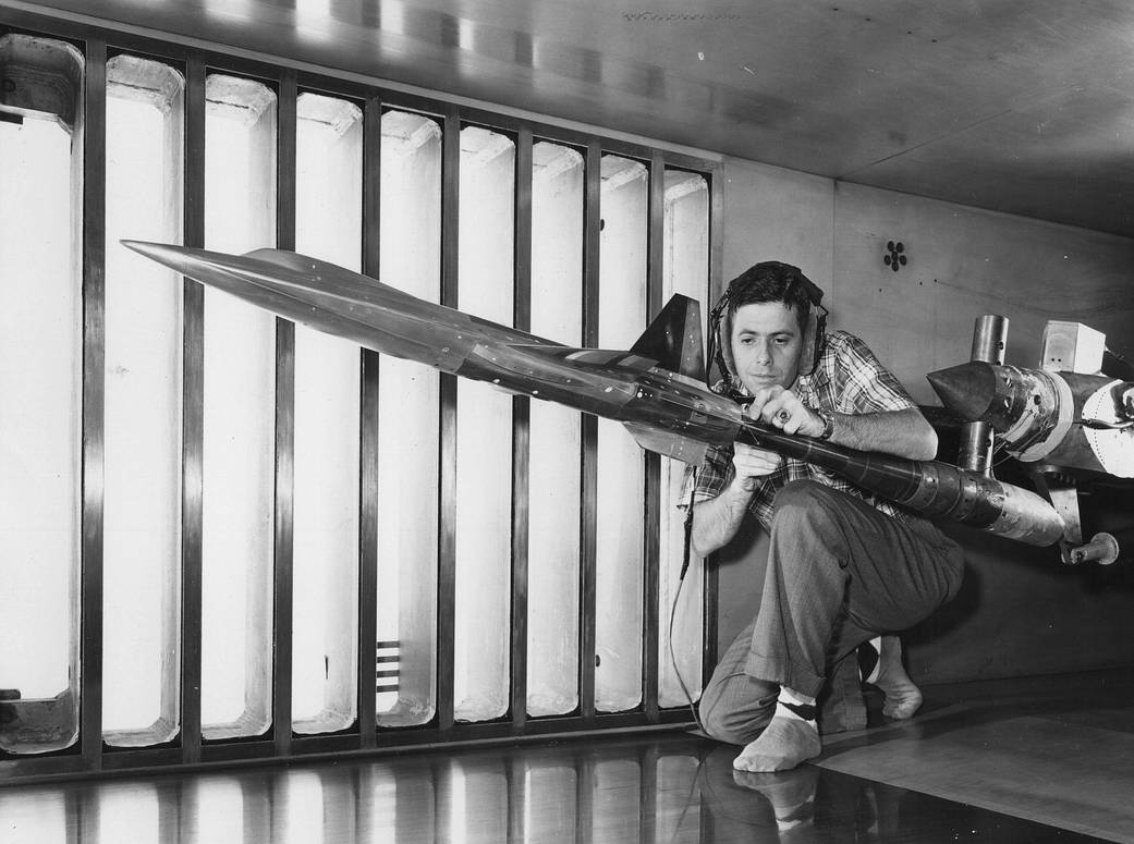 Black and white photo of a technician preparing for a test in Section 2.