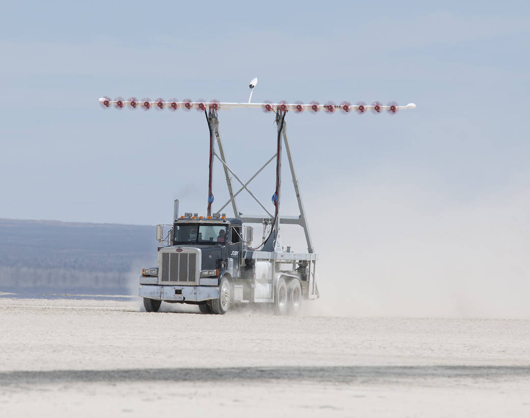NASA researchers test a wing with 18 electric motors on a specially instrumented truck