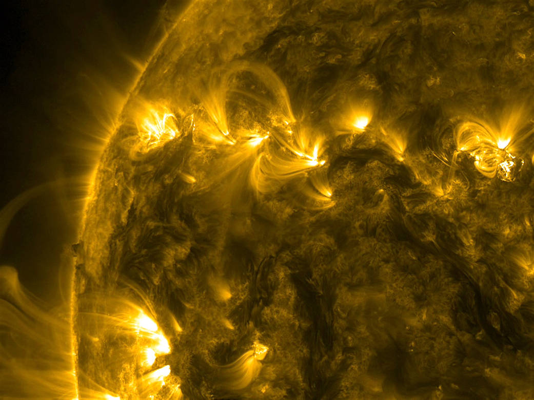 A half a dozen small solar active regions rotated into view as if tied together. 