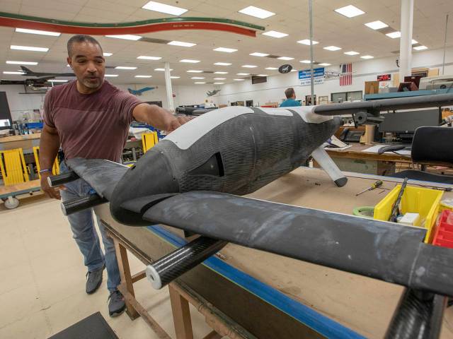 This image of a full-scale model of Langley Aerodrome No. 8 is being constructed at NASA’s Langley Research Center. The LA-8 model will to contribute to the agency’s Urban Air Mobility (UAM) initiative. Engineering technician Sam James is looking at the full-scale model.