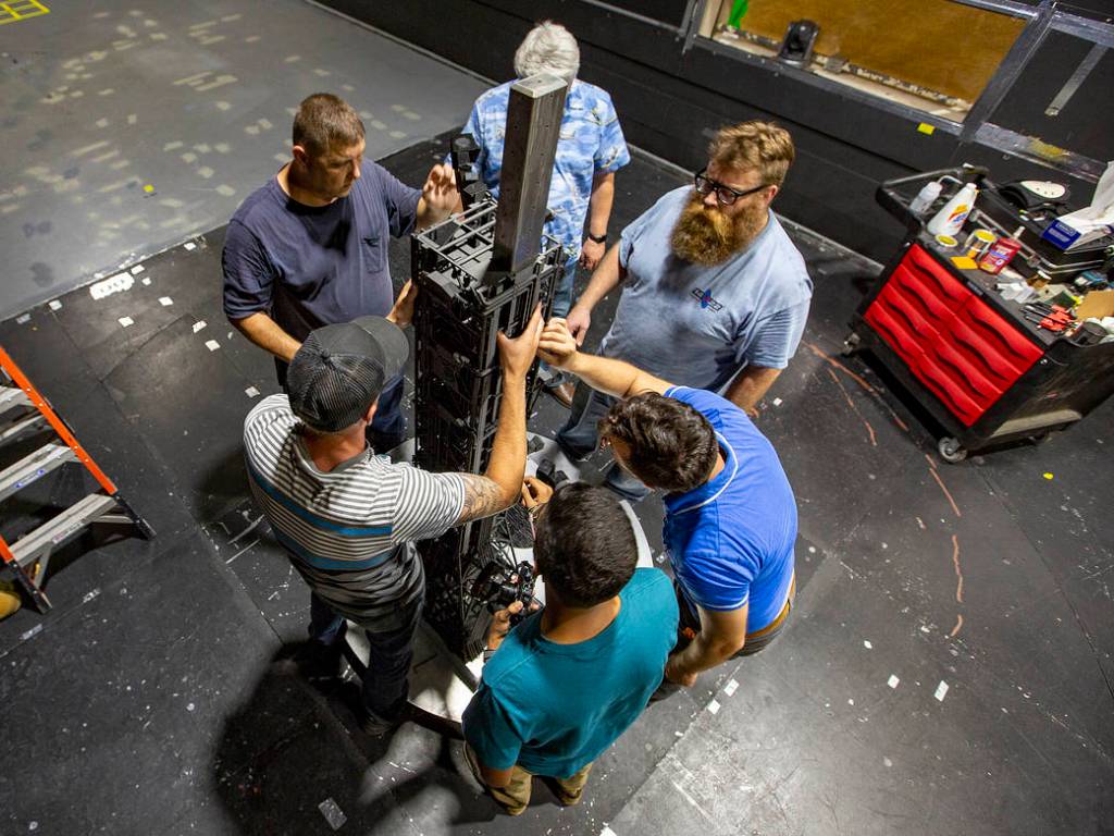 Researchers set up the SLS and launch tower models in the 14x22 subsonic wind tunnel at NASA's Langley Research Center.