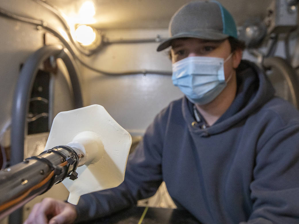 Technician setting up model in the wind tunnel