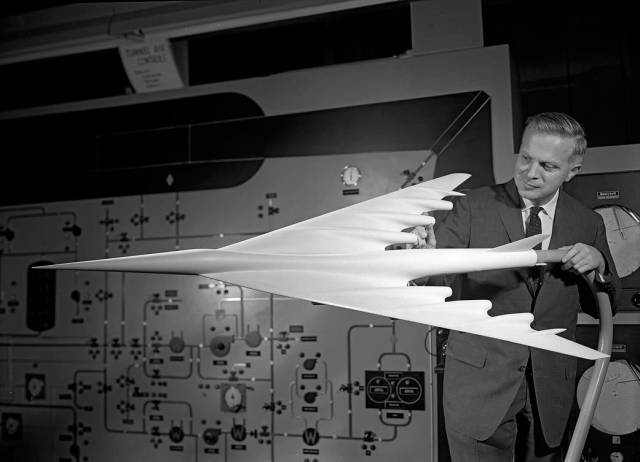 NASA aerodynamicist Richard Whitcomb with wind tunnel model, 1959