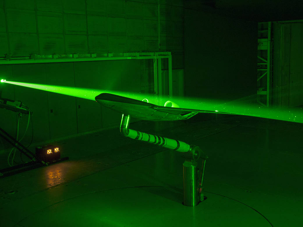 Engineers at NASA Langley used lasers inside the 14-by 22-Foot Subsonic Tunnel map how air flows over a Boeing BWB model.