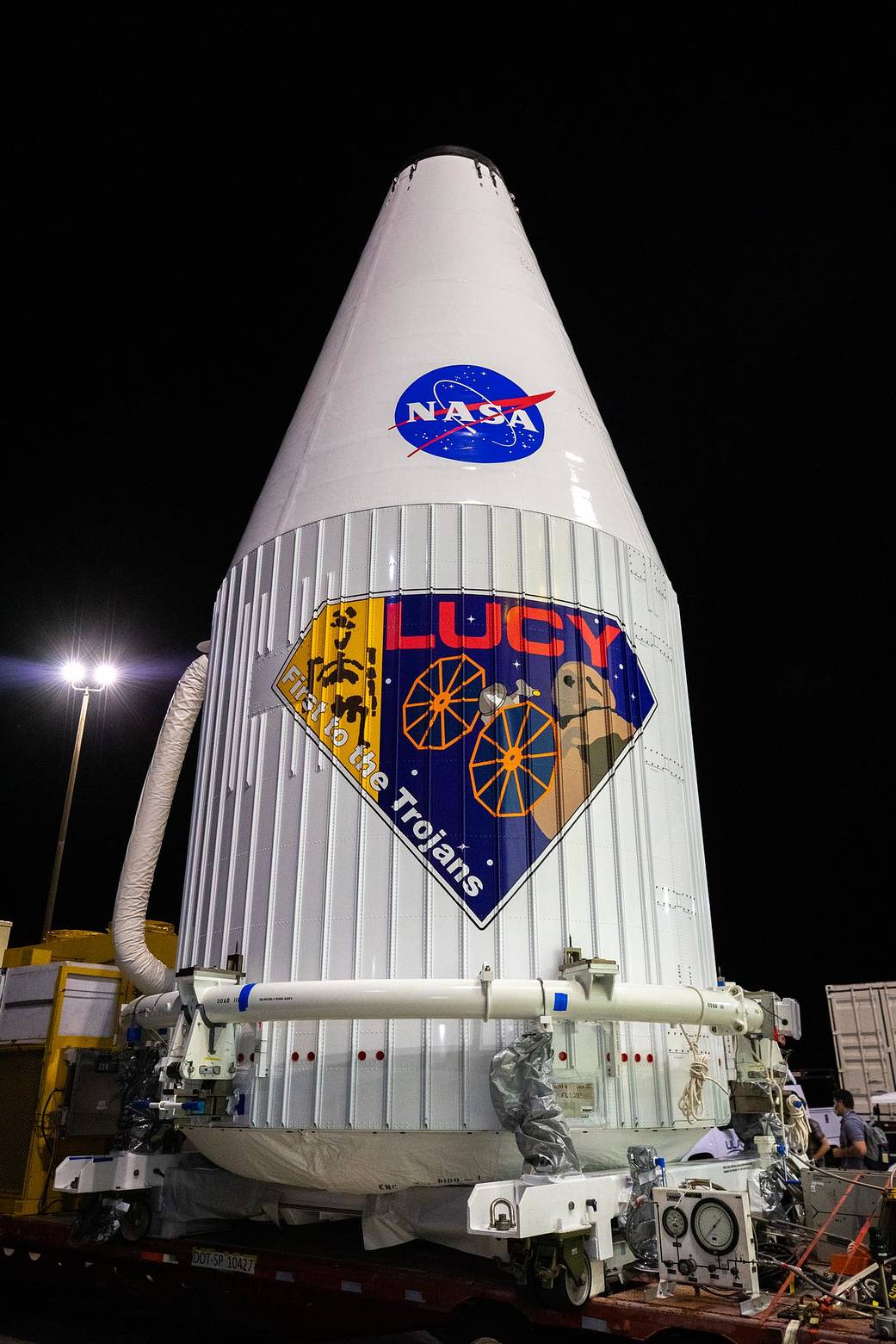 The Lucy spacecraft, encapsulated in its payload fairing, exits the Astrotech Space Operations Facility in Titusville, Florida on Oct. 7, 2021. The spacecraft was transported to nearby Space Launch Complex 41 at Cape Canaveral Space Force Station. 