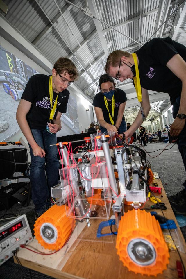 Students working on a Lunabotics mining craft