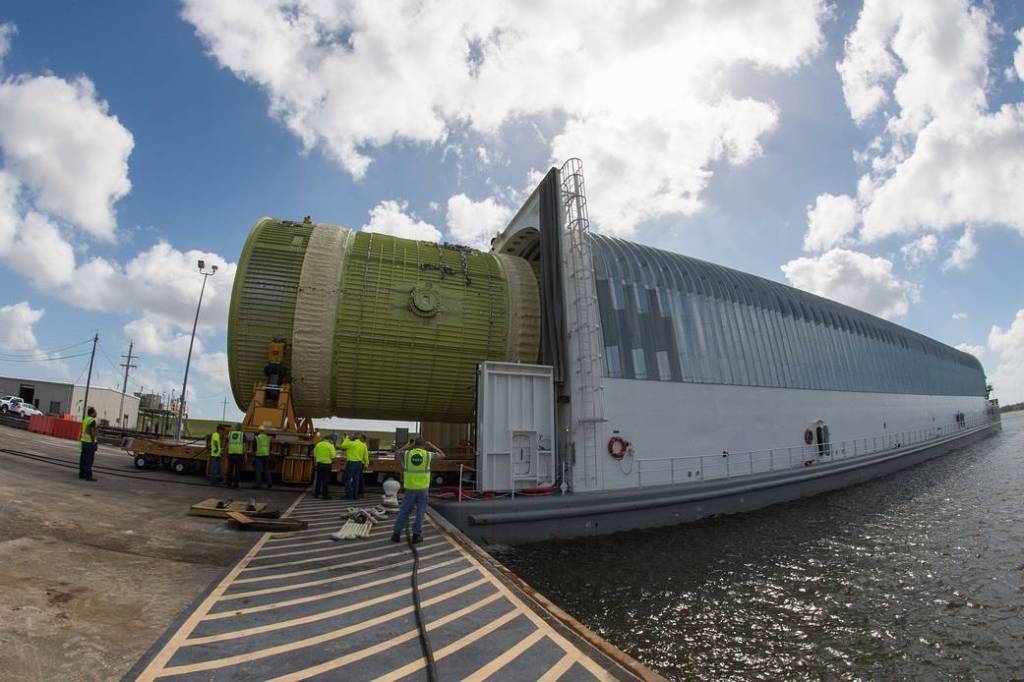 A structural test version of the intertank for NASA's Space Launch System, is loaded onto the barge Pegasus Feb. 22, 2018.