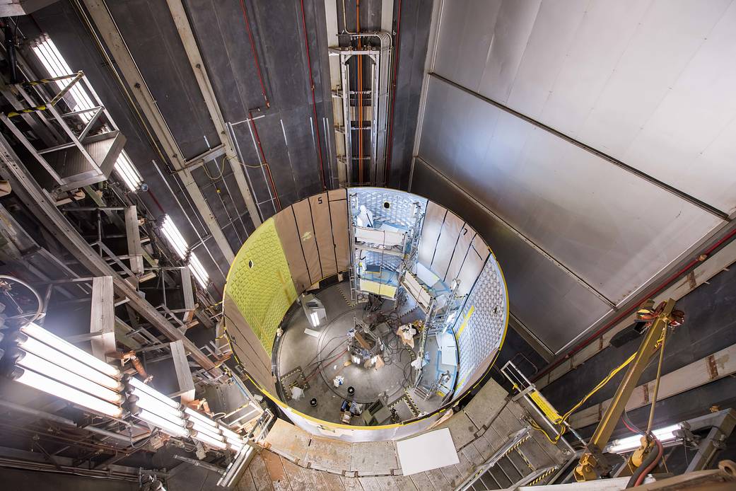 Technicians at Michoud perform priming operations on the SLS engine section qualification test article