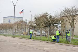 Workers with debris at NASA Michoud