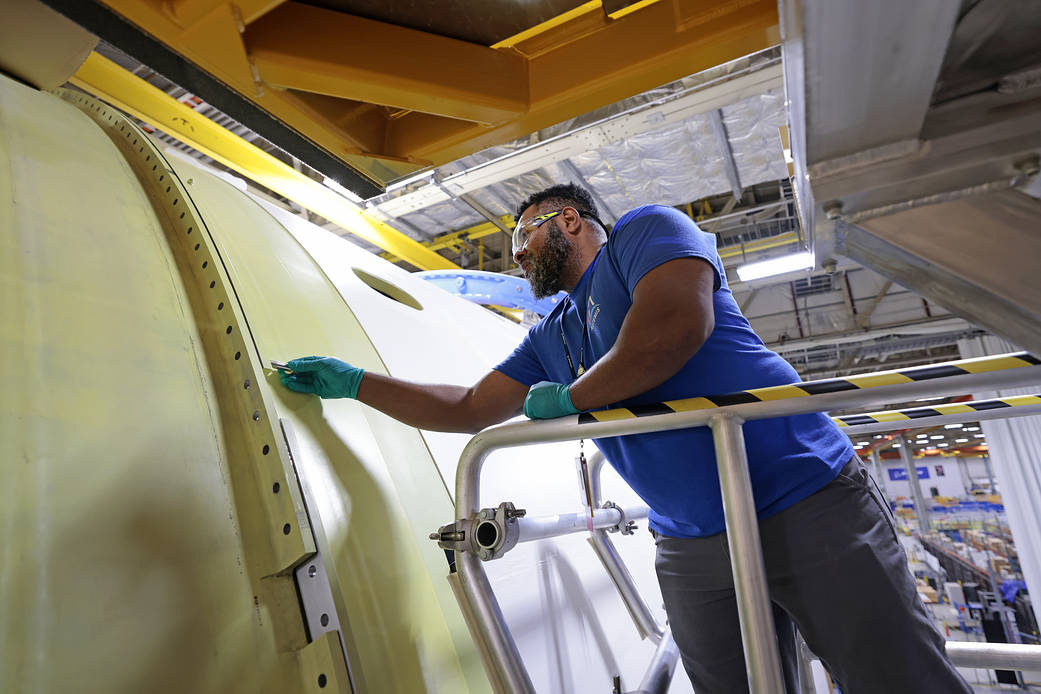 A person works on a part of Artemis II on March 11, 2023, at NASA’s Michoud Assembly Facility in New Orleans.