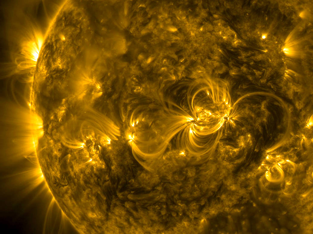 A series of linked loops across the face of the Sun highlighted the dynamic magnetic connections generated by several active reg