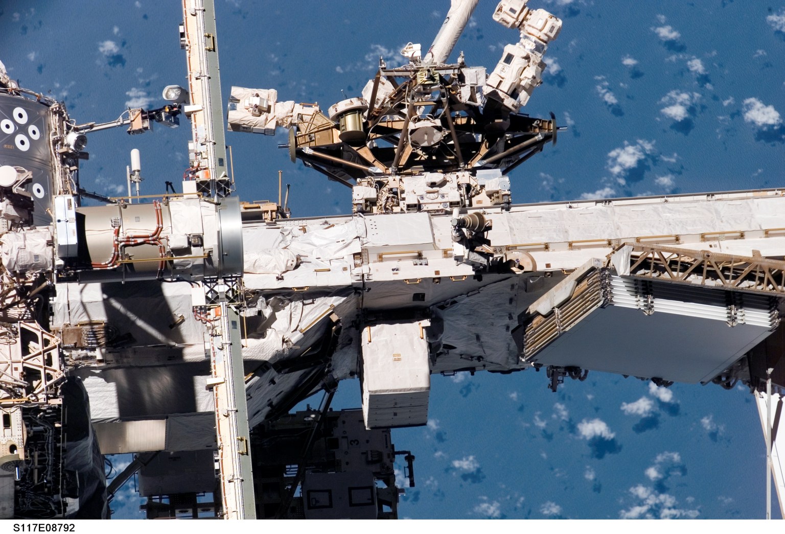 The Mobile Base System (MBS) is a work platform that moves on the Mobile Transporter rail car along truss rails covering the length of the space station. It provides a movable work platform for the Canadarm2 and Dextre as it traverses the main trusses to access any of eight worksites that feature power connections for the Base and any of its attachments.
