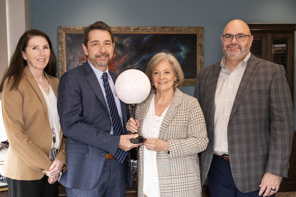 Dan Schumacher presents Jody Singer with a 3D-printed Moon lamp as a recognition for the successful Artemis I launch