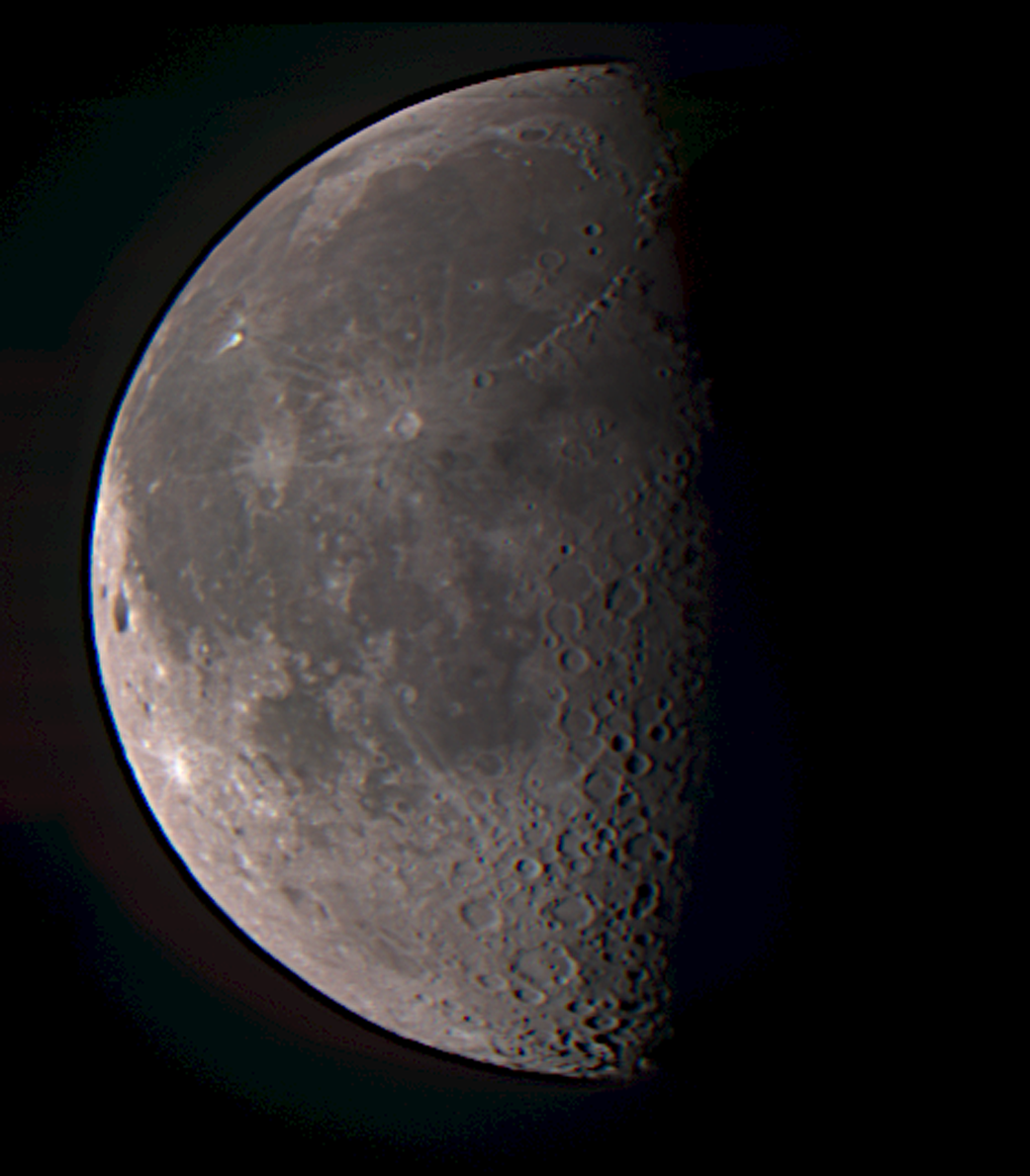 The moon seen close up, with the right side of the moon in the shade. 
