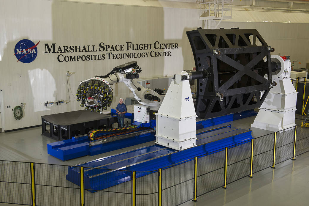 Automated fiber placement robot preparing to build large light composite rocket parts at NASA’s Marshall Space Flight Center.