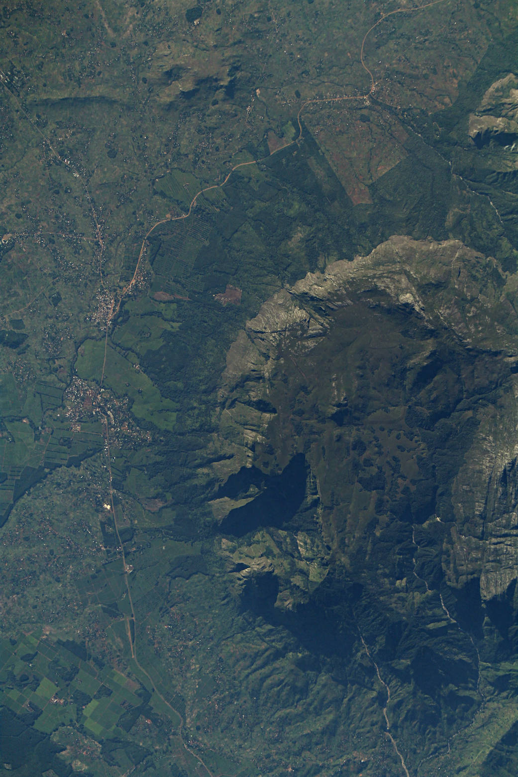 The image shows Mulanje Massif in southern Malawi. The Mulanje Massif  rises sharply from the surrounding plains of Chiradzulu, 