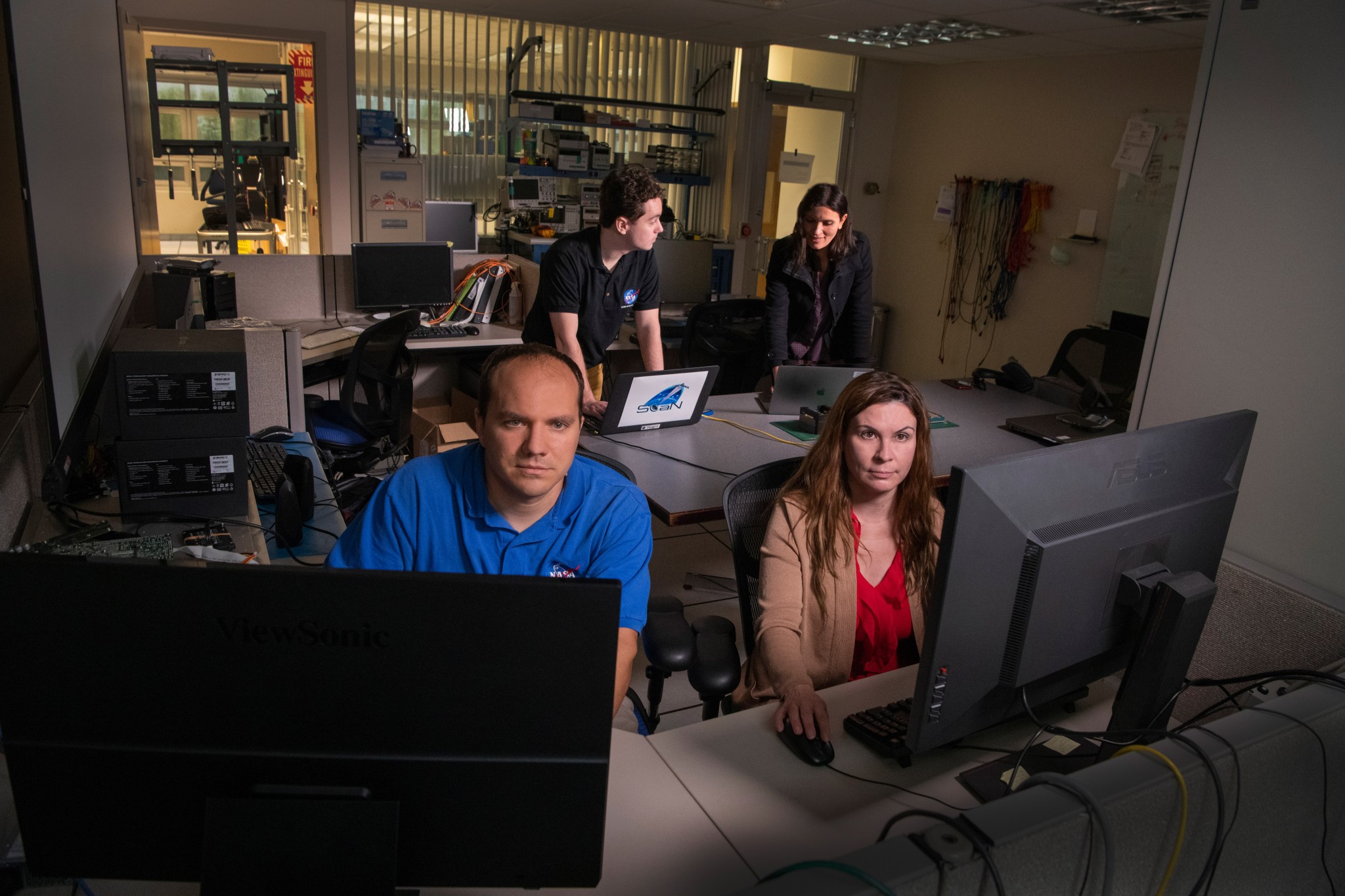 Engineers from NASA Glenn’s Space Communications and Navigation group conduct testing on the HDTN system.