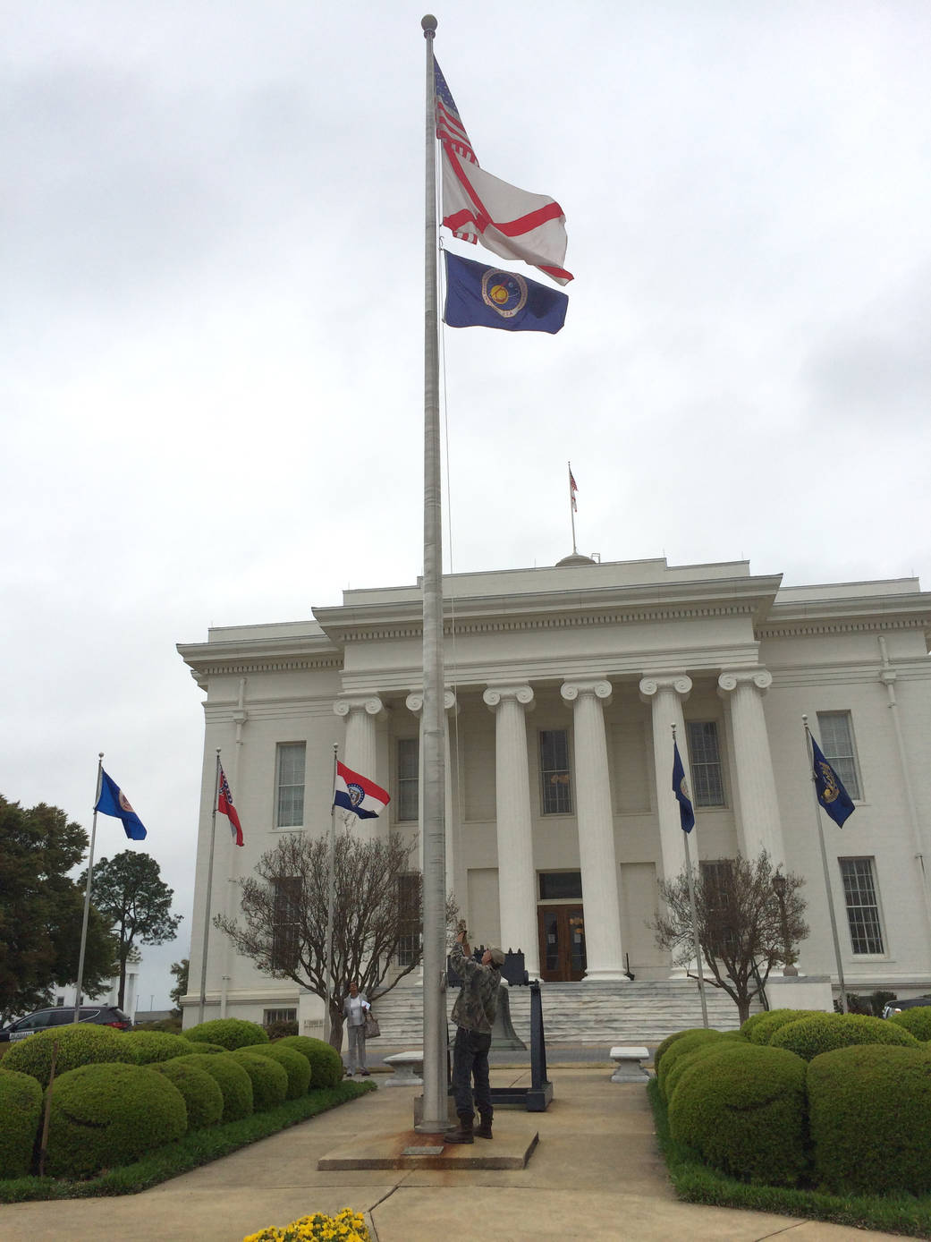 NASA's flag is unfurled beneath the U.S. and Alabama flags at the state Capitol in Montgomery April 3 to honor "NASA Alabama Aer