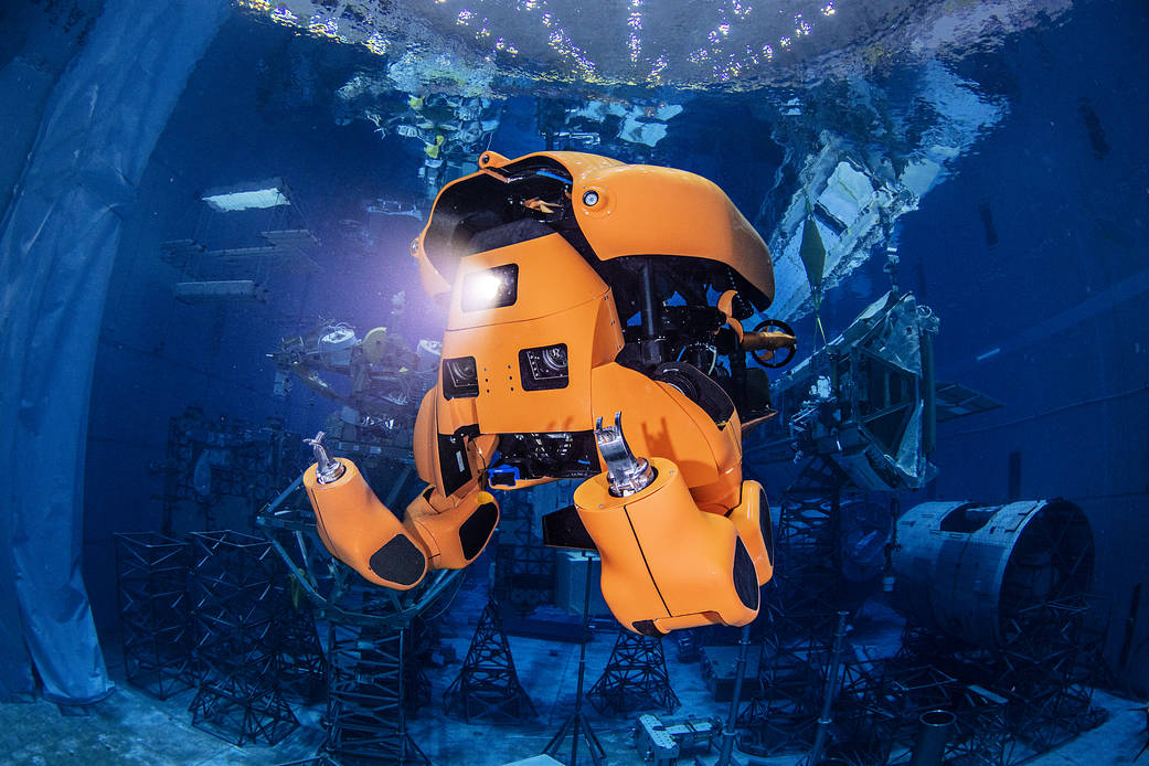 Aquanaut under water working.