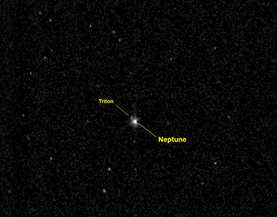View of the giant planet Neptune and its large moon Triton
