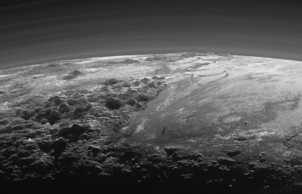 Pluto's mountains, frozen plains and foggy hazes