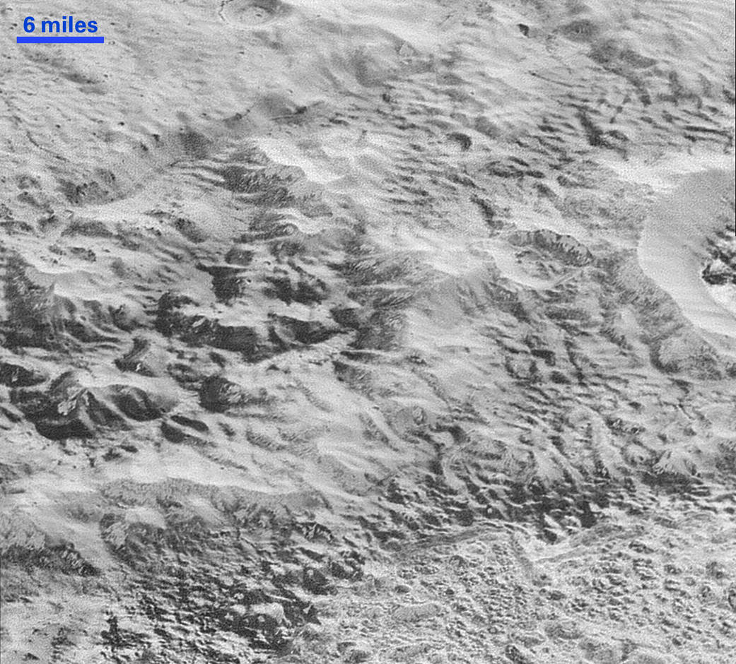 erosion and faulting has sculpted this portion of Pluto’s icy crust into rugged badlands