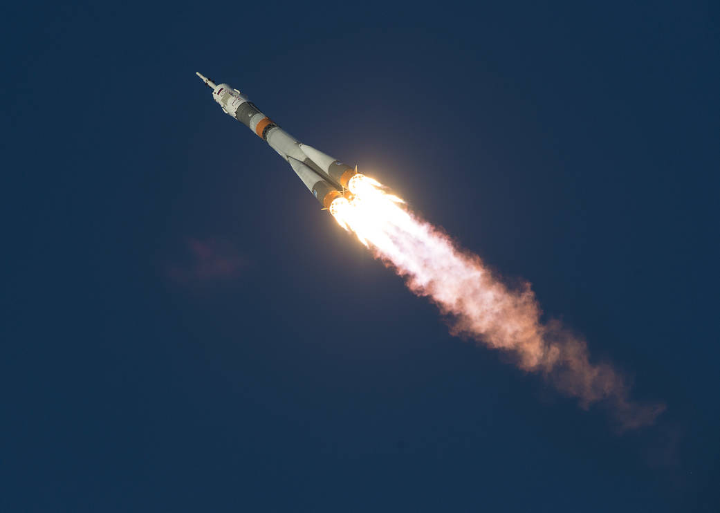 Soyuz rocket streaks across sky moments after launch, on the way to the International Space Station