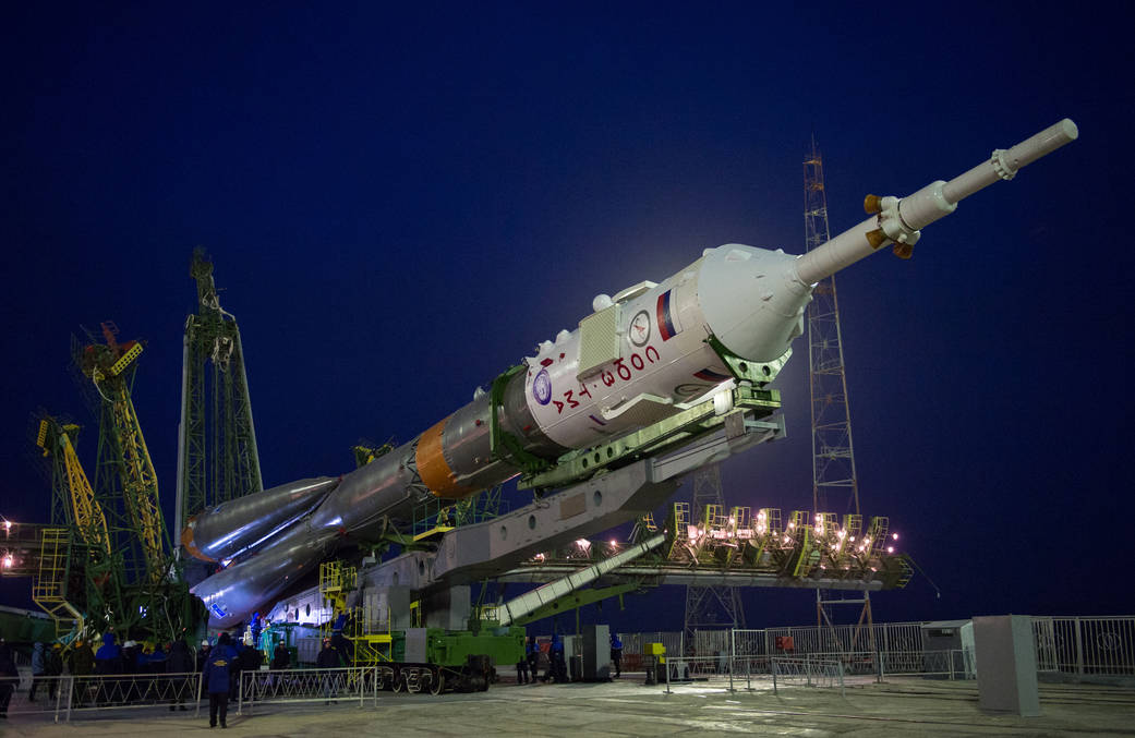 The Soyuz TMA-20M spacecraft is raised into position
