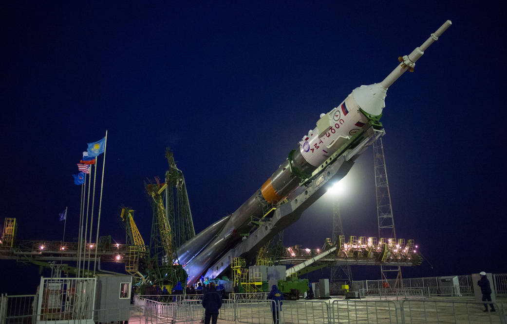 The Soyuz TMA-20M spacecraft is raised into position