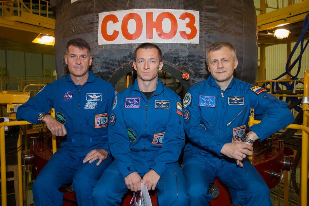 The Expedition 49 Crew is Pictured in Front of the Soyuz MS-02 Spacecraft