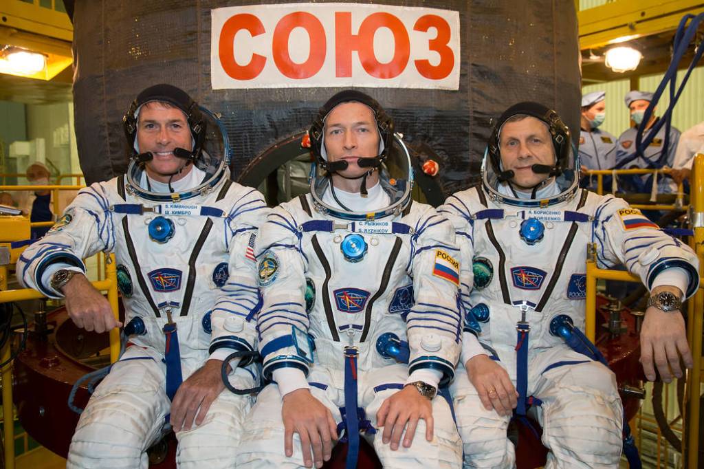 The Expedition 49 Crew is Pictured in Front of the Soyuz MS-02 Spacecraft