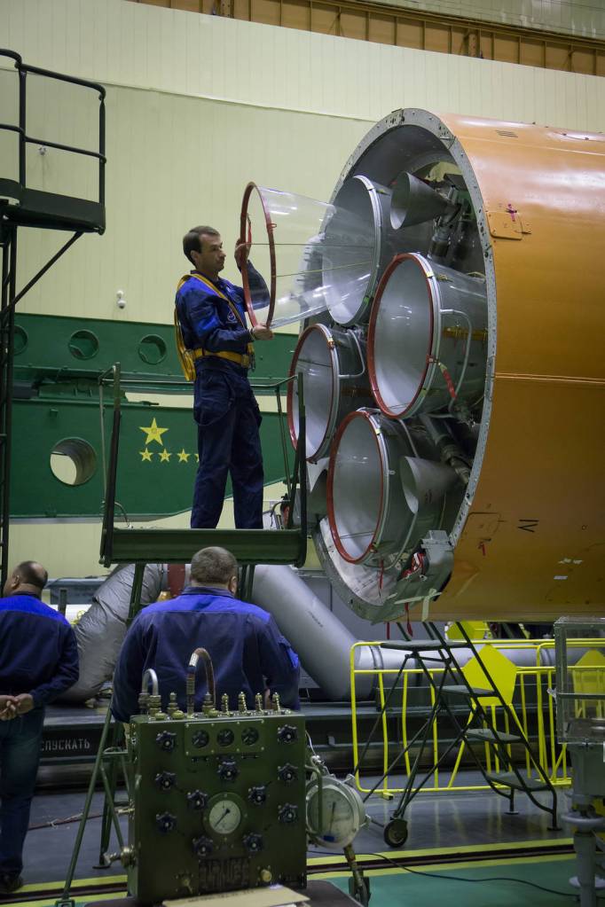 A Worker Removes a Cover from a Soyuz Rocket Engine