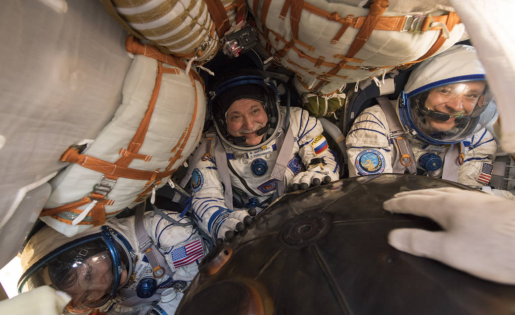 Expedition 52 Flight Engineer Peggy Whitson, left, Commander Fyodor Yurchikhin of Roscosmos, center, and  Fight Engineer Jack Fi