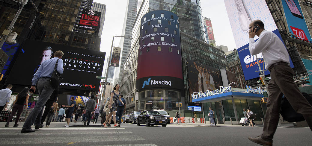 People walking by Nasdaq MarketSite tower