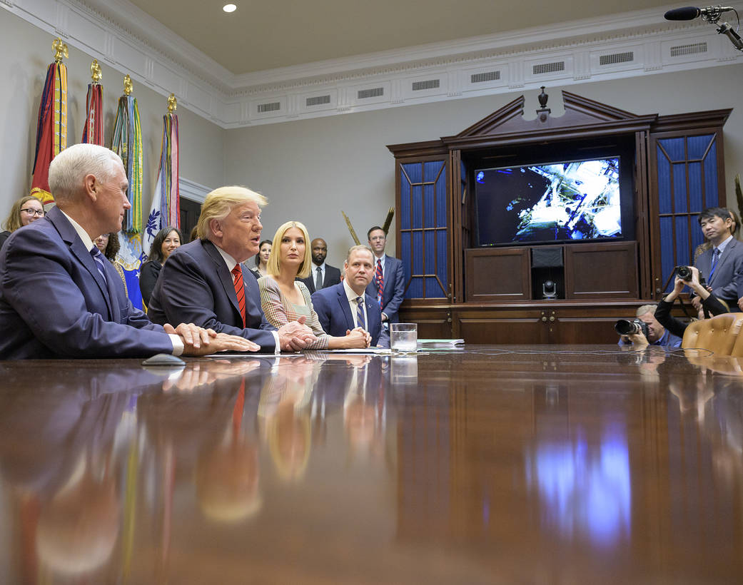 President Donald Trump speaks with NASA astronauts Christina Koch and Jessica Meir during the first all-woman spacewalk.