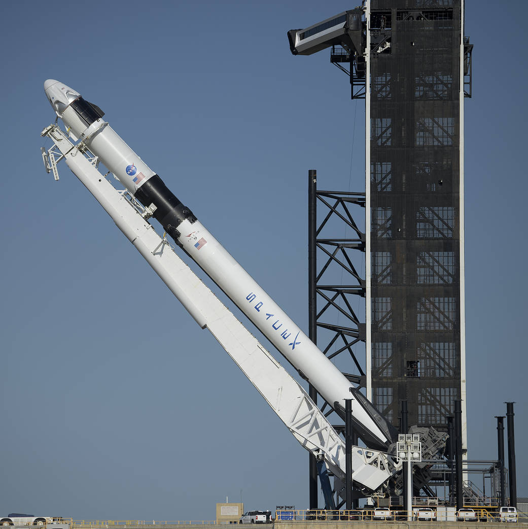A SpaceX Falcon 9 rocket with is raised into a vertical position on May 21, 2020.