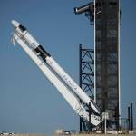 A SpaceX Falcon 9 rocket with is raised into a vertical position on May 21, 2020.