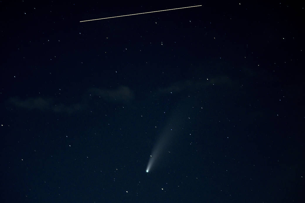 The International Space Station s seen in this 10 second exposure above comet NEOWISE, July 18, 2020 from Keys Gap, WV..